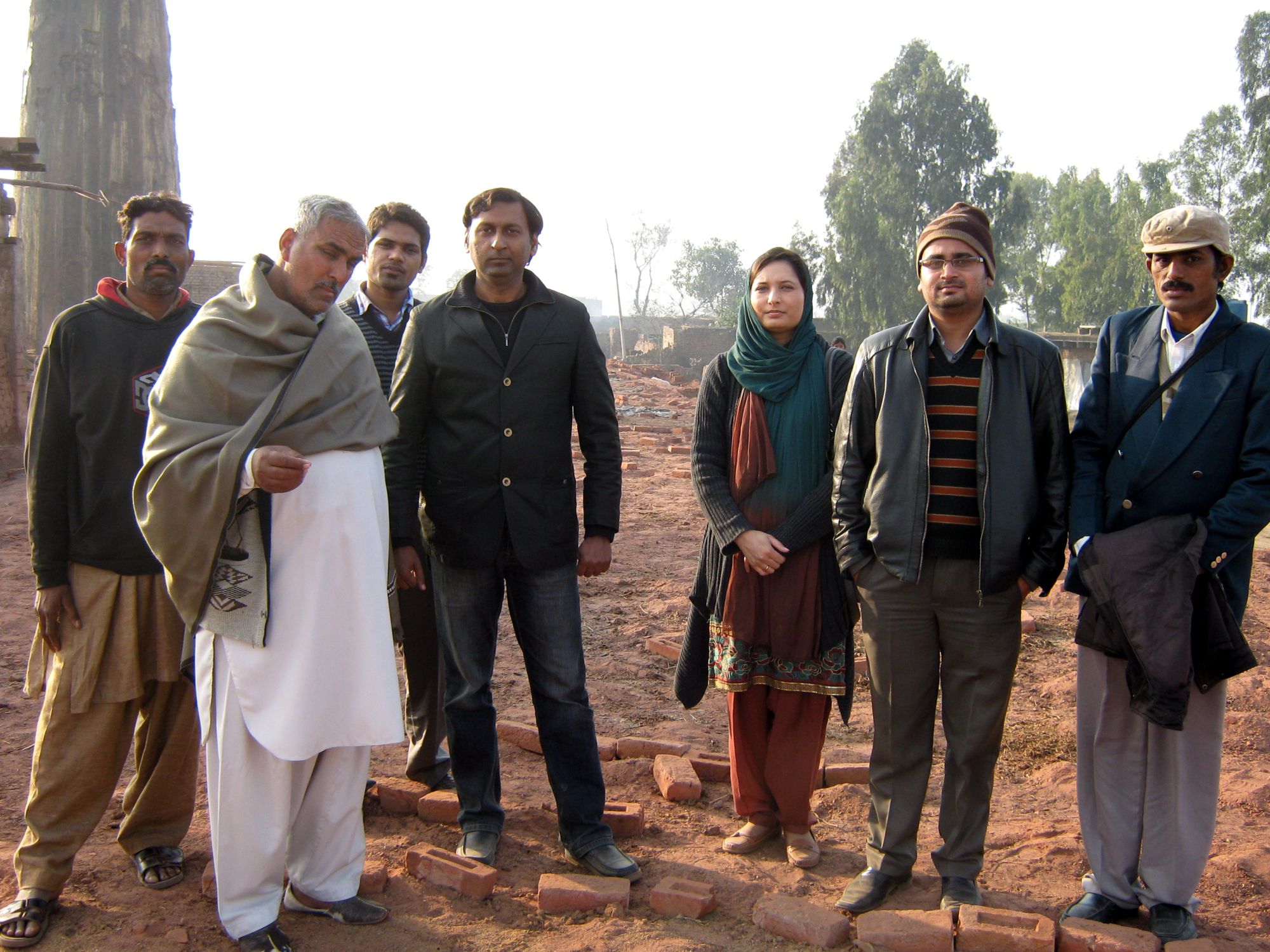 Brick kiln owner in white shalwar qameez, PSTA team and myself.